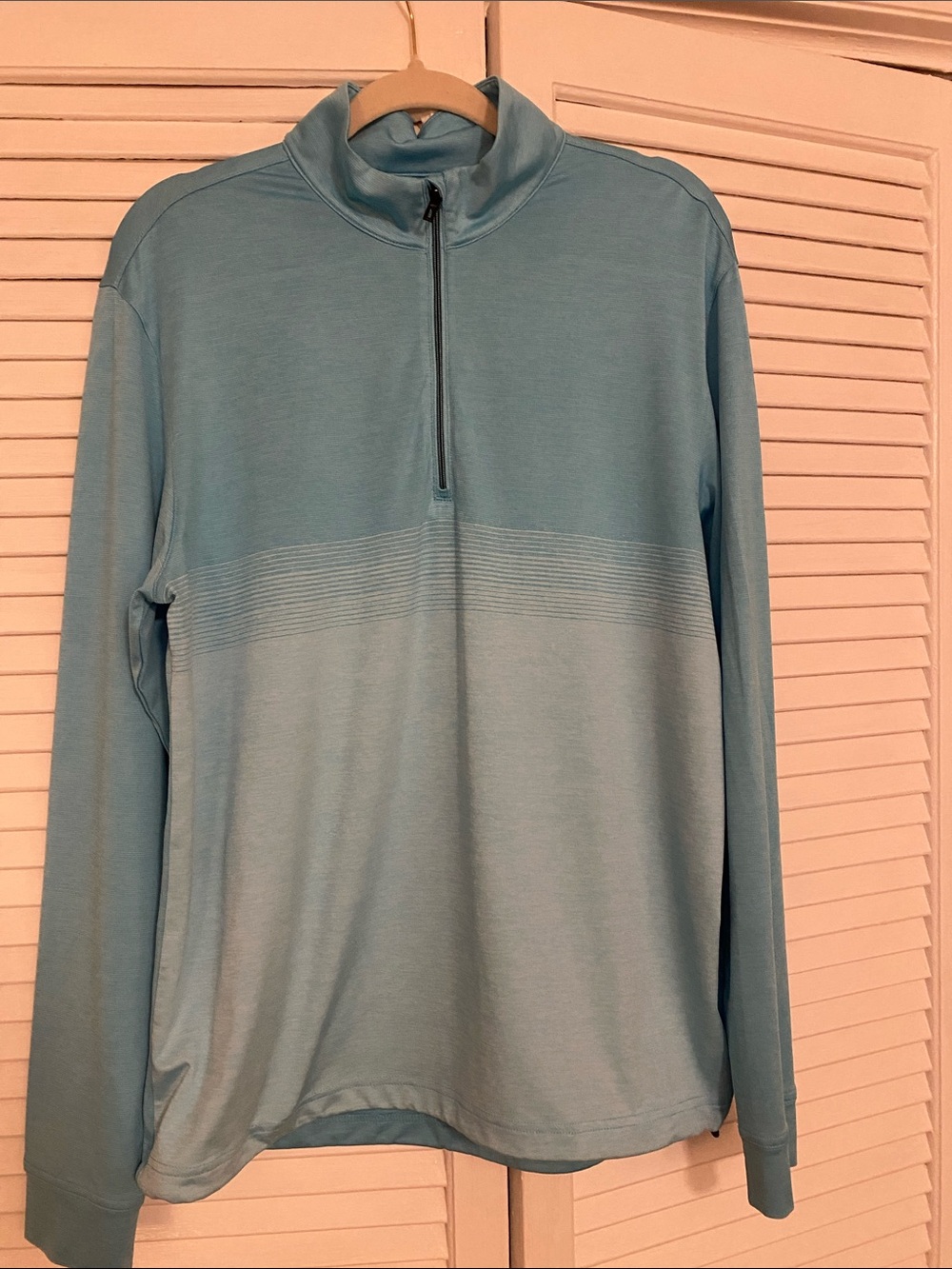 Greg Norman Collection Light Blue Performance Polo with Multicolor Shark Logo